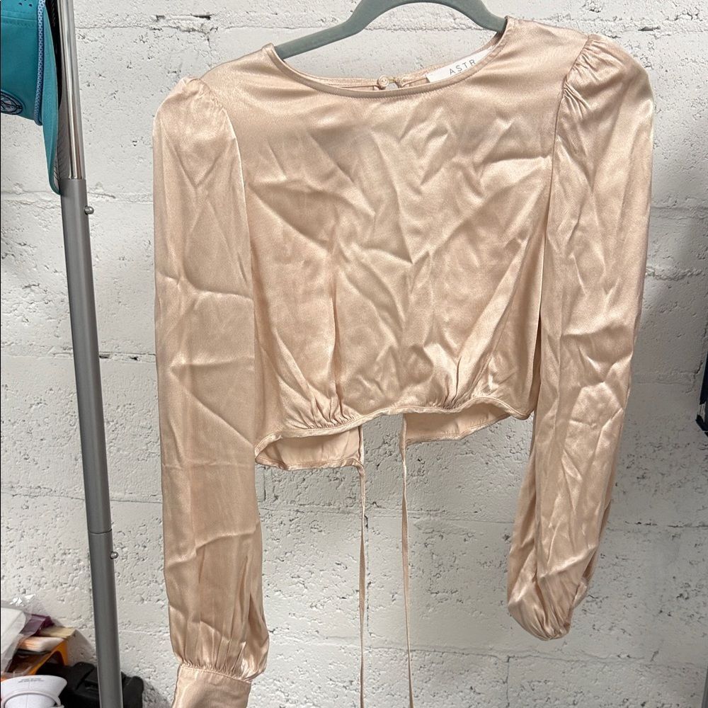 ASTR The Label Satin Blouse in a Peach Cream Long Sleeve Crop Top Open Back